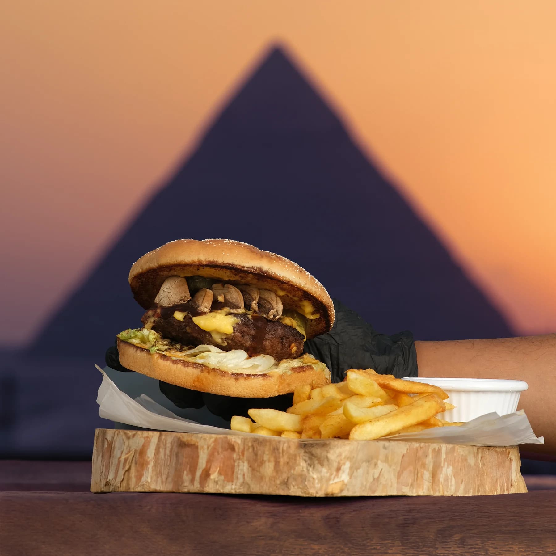 Camel burger with the Pyramids at dusk